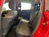 a red car that is sitting in the back of the car