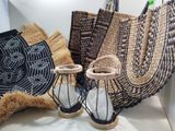 a basket and a pair of sandals sitting on a table