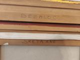 a close up of a piece of wood with writing on it