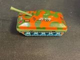 a small toy tank that is sitting on a table