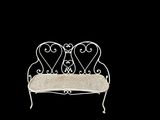 a white bench with two hearts on it in the dark