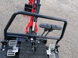 a close up view of the front of a red tractor