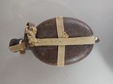 a small wooden object with a strap around it
