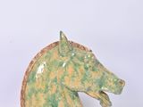 a green horse head on a white background