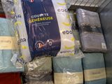 a lot of blankets that are on display in a store