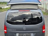 a van that is parked on the side of the road