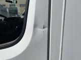 a close up of a door handle on a white van