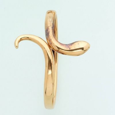 a gold ring with a curved design on it