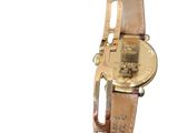 a close up of a watch on a white background