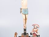 statue of jesus on the cross with three wise men and a dog