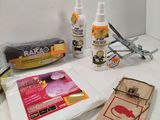 a mousetrage, a mousetrage, glue, and other craft supplies on a table