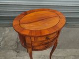 an image of a small wooden table with a drawer on it