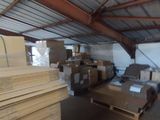 boxes and pallets are stacked on pallets in a warehouse