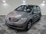the mercedes b - class is parked on a checkered floor in a garage