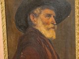 portrait of an old man with a black hat and a red robe