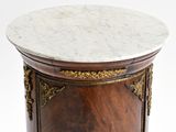 a marble top table with a wooden base and a marble top