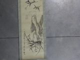 a scroll with a drawing of a bird on it