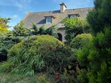 an image of a house in the middle of a garden