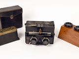 three different types of antique cameras on a white surface