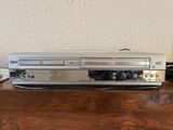 a dvd player that is sitting on top of a wooden table