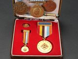 a small case with medals and other items in it