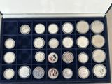 a lot of coins in a box on the table