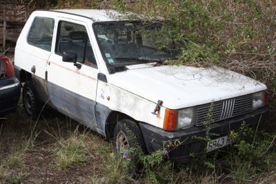 a white van that is parked in the grass