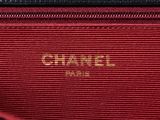 a close up of a red and black bag with a gold logo