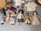 a lot of dolls that are sitting on a table