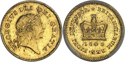 a gold sovereign coin with a crown on top of it