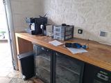 a counter that has a bunch of appliances on it