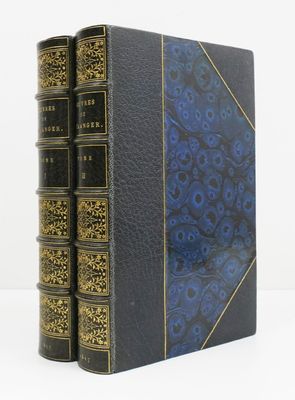the three books are lined up on a white surface