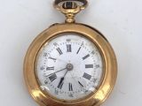 an image of a gold pocket watch with roman numerals on the face