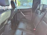 the back seats of a car are empty in a parking lot
