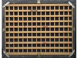 a picture of a metal grill grate with a number on it