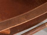 a wooden chair with a leather seat and back rest