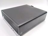 a black computer on a white surface with a white background