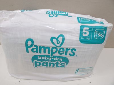 a bag of diapers sitting on top of a toilet