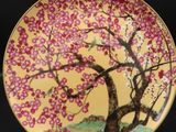 a close up of a plate with a tree on it