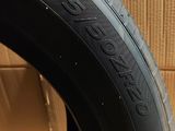 a close up of a tire with a box in the background