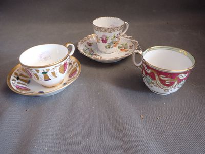 three cups and saucers are sitting on a table