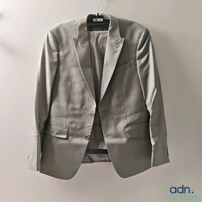 an image of a suit hanging on a hanger