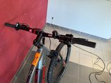 a bicycle that is parked against a wall