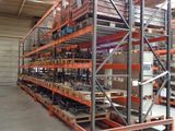 a large rack with many items in it in a warehouse