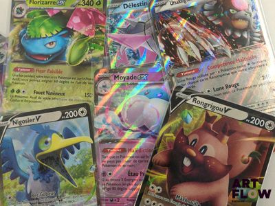 a lot of pokemon cards that are on the table