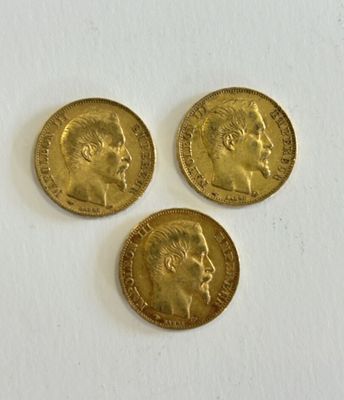 three gold sovereigns, one with the head of a man and one with a woman