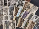 a lot of old black and white photos on the table