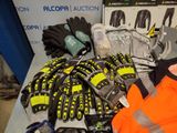 a pile of gloves, gloves, gloves, gloves, and other items on a table