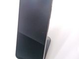 a cell phone that is sitting on top of a stand