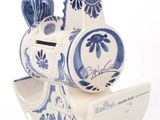 a small blue and white rocking horse on a white background